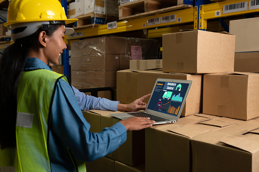 Female warehouse worker using MYOB Advanced software